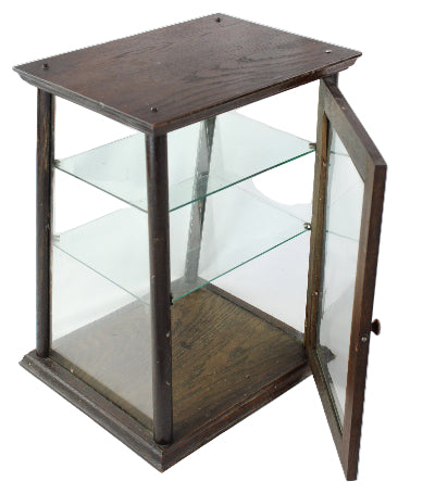 Hexagonal glass display case with wooden frame on a white background