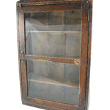 Wooden display case with glass panels on a white background