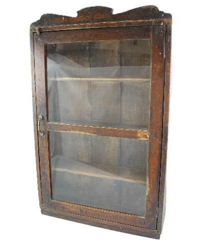 Wooden display case with glass panels on a white background