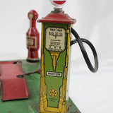 Vintage toy gas pump with 'Gas' sign on a white background