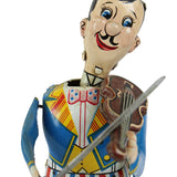 Colorful vintage toy figure of a man playing a violin on a white background