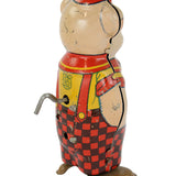 Vintage tin toy with checkered pattern on a white background