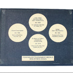 Medal display case with four major tournament medals won by Ben Hogan on a white background