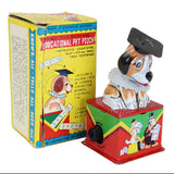 Toy dog with a box labeled 'Educational Pet Pouch' on a white background