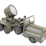 Toy military vehicle with a large light on top, on a white background