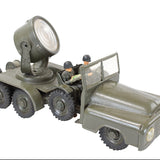 Toy military vehicle with a large light on top, on a white background