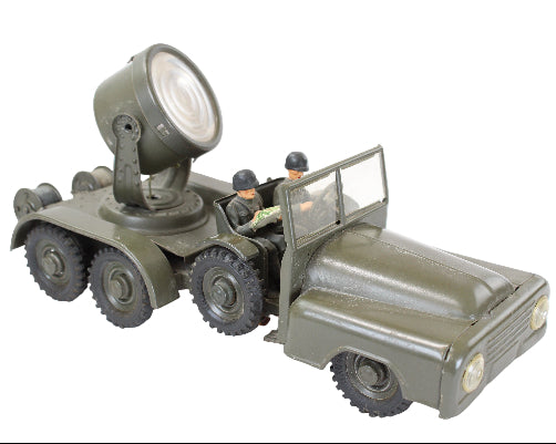 Toy military vehicle with a large light on top, on a white background