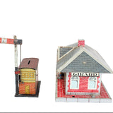Model train station with a signal and 'Girard' branding on a white background