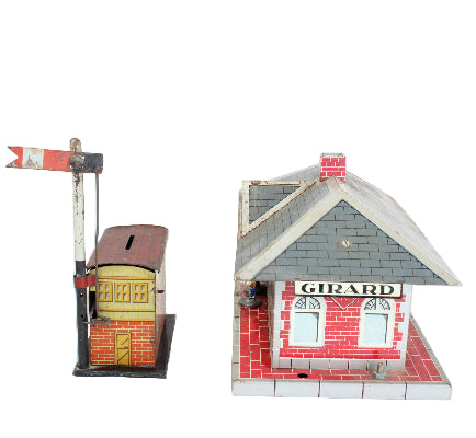 Model train station with a signal and 'Girard' branding on a white background