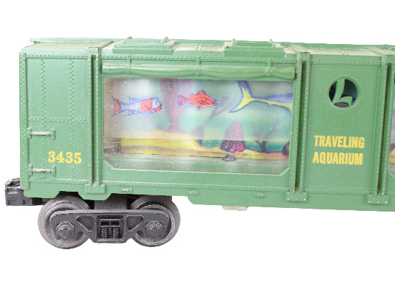 Toy train car labeled 'Traveling Aquarium' with fish illustrations on a white background