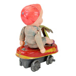 Toy figure with a red head and yellow body on a white background