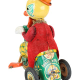 Vintage toy with a red figure and colorful wheels on a white background