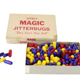 Box of colorful Magic Jitterbugs toys with a cardboard box on a white background