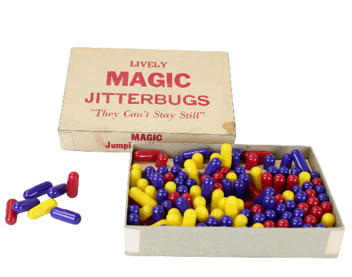 Box of colorful Magic Jitterbugs toys with a cardboard box on a white background