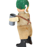 Toy figure with a green head and brown body on a white background
