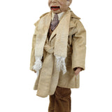 Vintage doll with a beige suit and brown shoes on a white background