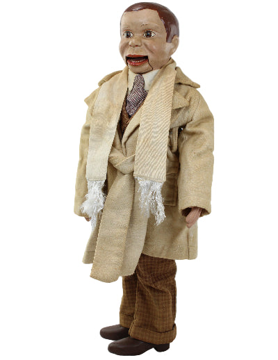 Vintage doll with a beige suit and brown shoes on a white background