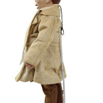 Mannequin wearing a beige outfit with brown pants on a white background