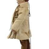 Mannequin wearing a beige outfit with brown pants on a white background