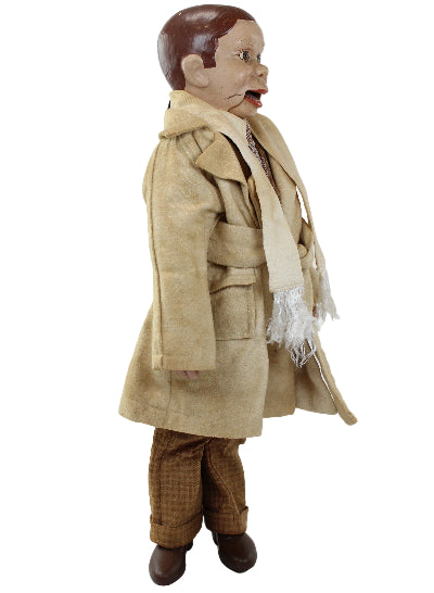 Mannequin wearing a beige coat and brown pants on a white background