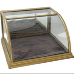 Glass display case with brass frame on a white background