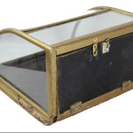 Vintage display case with glass top and brass frame on a white background