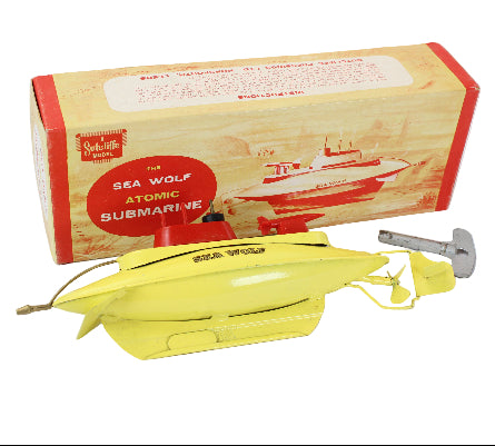 Yellow toy submarine with packaging labeled 'Sea Wolf Atomic Submarine' on a white background