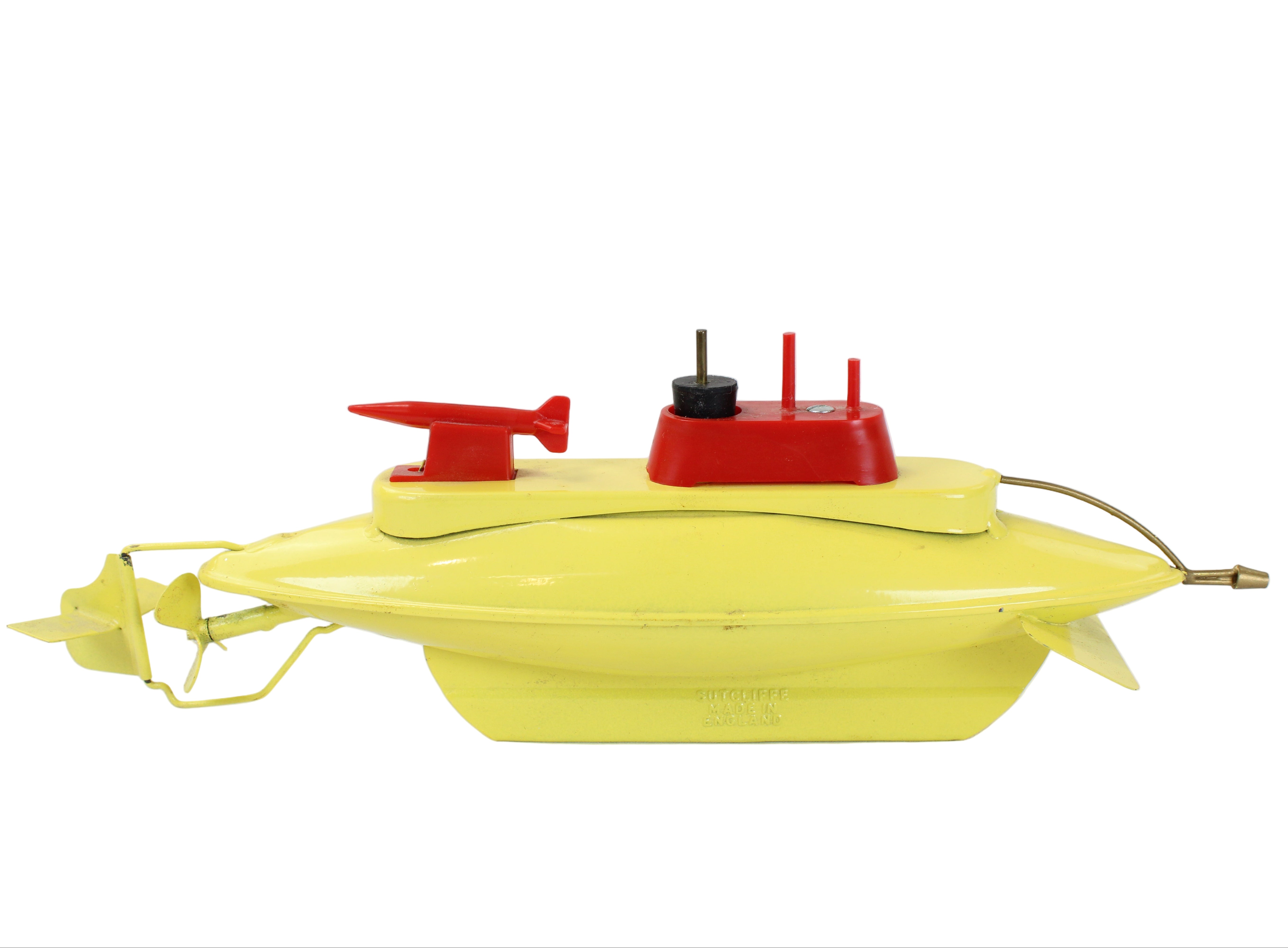 Yellow toy submarine with red controls on a white background