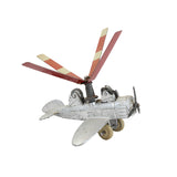 Model airplane with red propeller on a white background