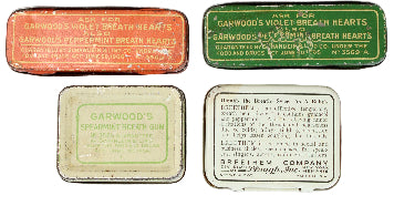 Collection of vintage small metal boxes with different designs and text on a white background
