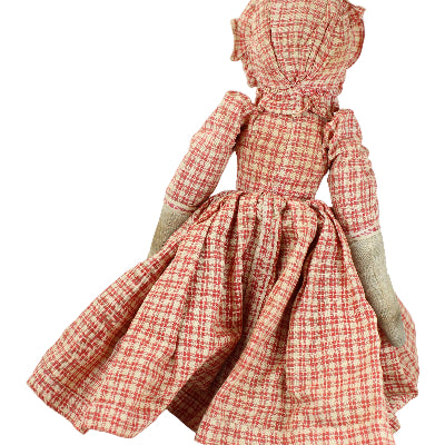 Doll wearing a red and white checkered dress on a white background