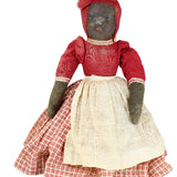 Vintage doll with red and white checkered dress on a white background