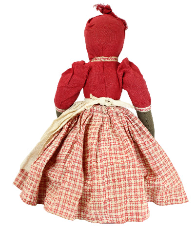 Traditional doll with a red dress and plaid skirt on a white background