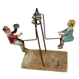 Antique Gibbs Children On A Teeter Totter Motion Tin Toy