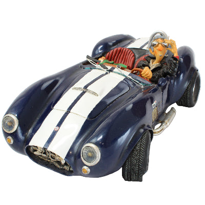 Model car with a driver figure on a white background