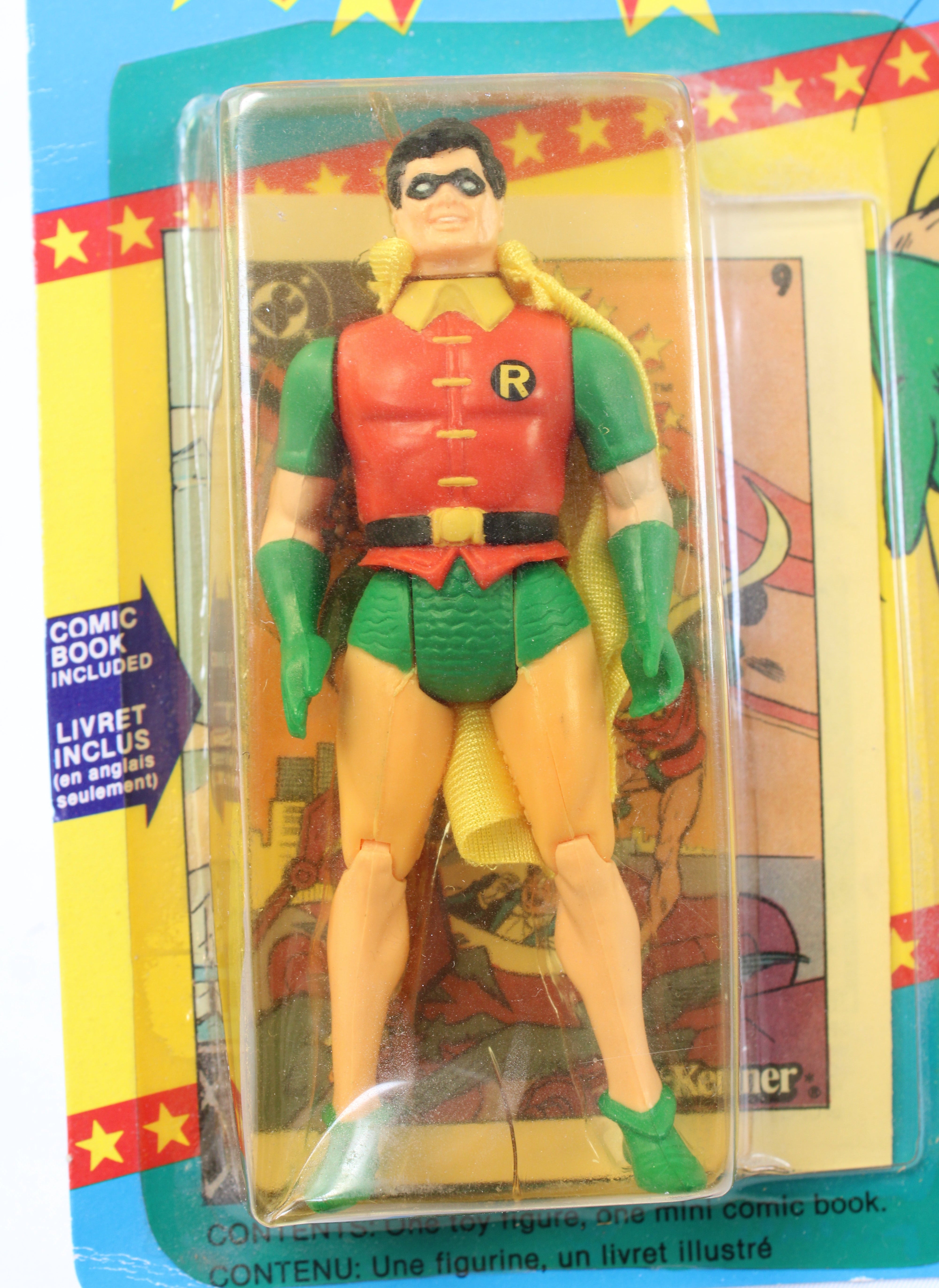 Superhero action figure in packaging with colorful background