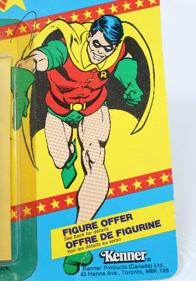 Vintage Kenner action figure packaging with a superhero character on a colorful background