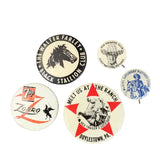 Collection of vintage buttons with different designs and text on a white background