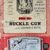 Vintage packaging of a buckle gun toy by Mattel on a white background