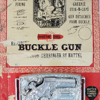 Vintage packaging of a buckle gun toy by Mattel on a white background
