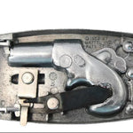 Metallic toy revolver with a silver finish on a light gray background