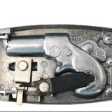 Metallic toy revolver with a silver finish on a light gray background