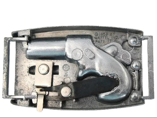 Metallic toy revolver with a silver finish on a light gray background