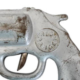 Vintage revolver with 'Red Hand' branding on a white background