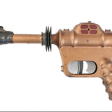 Bronze-colored gun-like object on a white background