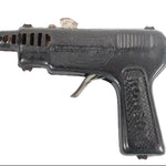 Black toy gun on a white background