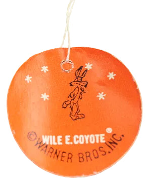 Round orange tag with a black outline of a character and 'Wile E. Coyote' text, hanging on a white background.