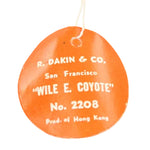 Round orange tag with white text on a white background