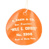 Round orange tag with white text on a white background