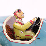 Toy car with a driver figure on a white background
